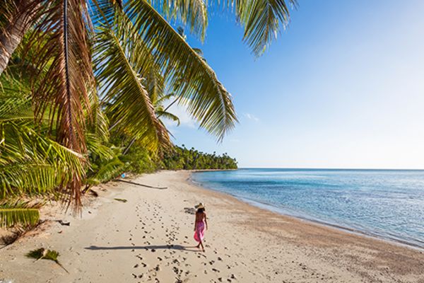 Woman walking along a beach