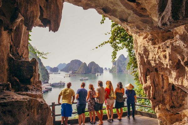 Group of people looking out at a bay from a viewing platform built into a rock