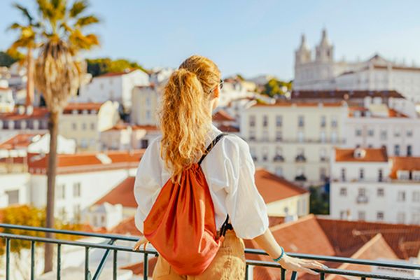 Woman looking out at the city of Lisbon