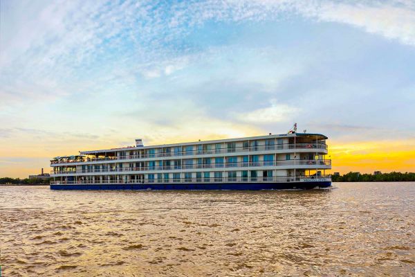 Drone shot of river ship cruising down the Mekong River