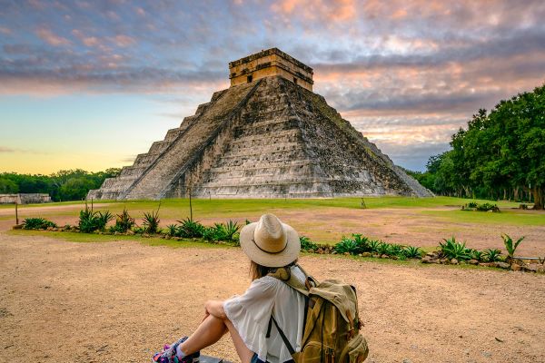 Tourist exploring Chichen-Itza archaeological site, Yucatan, Mexico