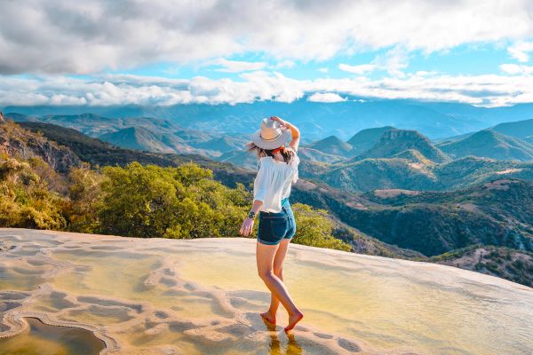 Woman walking on the limestone rock formations at Hierve el Agua, Oaxaca, Mexico