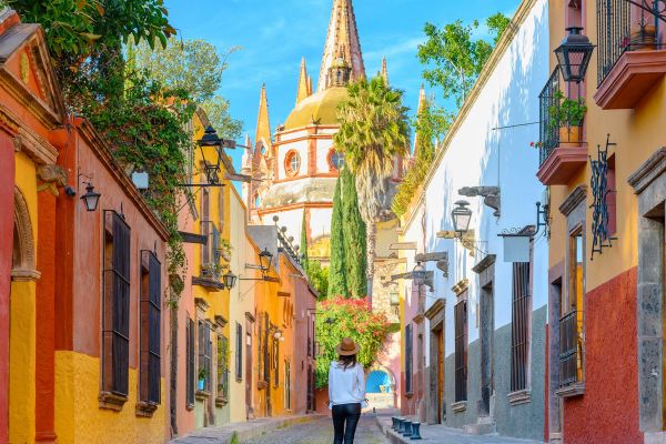Woman admiring the parish church in San Miguel de Allende, Mexico