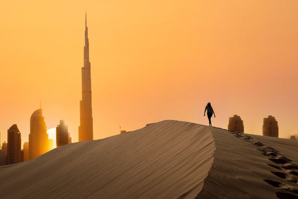 Woman standing on the  terrace on the  background of Giza pyramids