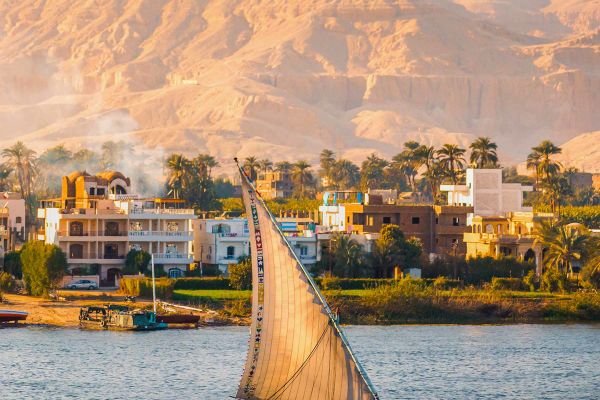 Small sailing boat along river