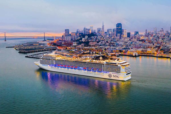 USA, New York, New York City, Mother and baby in Brooklyn with Manhattan Bridge in the background