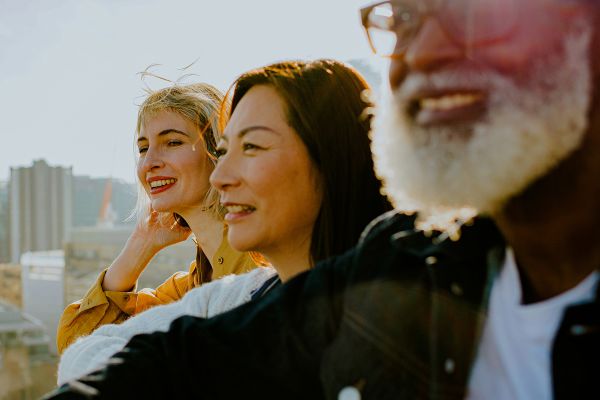 Close shot of people smiling on a lookout