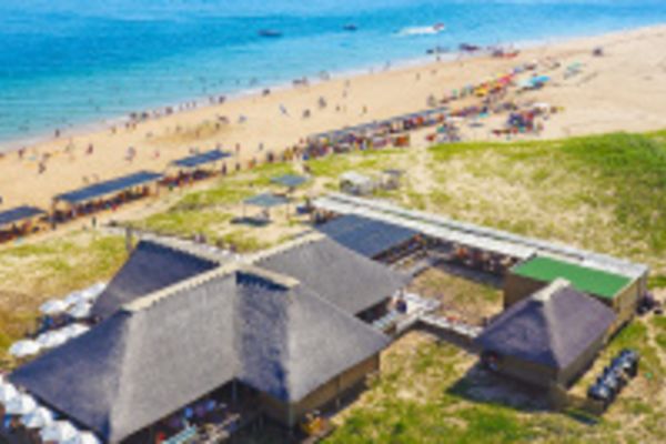 A view of the beach and resort on a Portuguese island that can be visited via a Portuguese island cruise from South Africa.