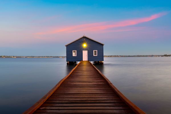 Four women chatting, sitting on a rooftop