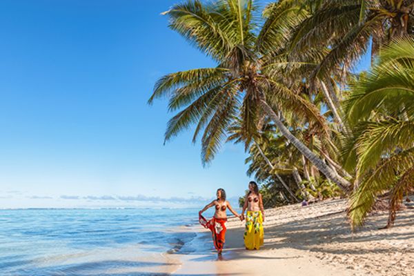 two ladies on beach in rarotonga 