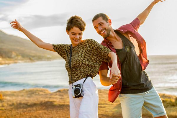 Couple on hill overlooking the beach