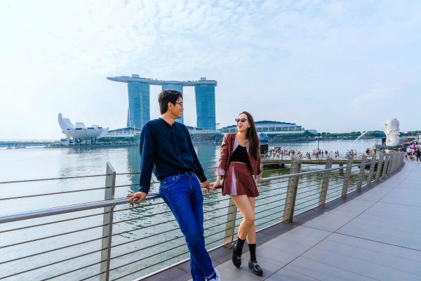 Woman looking down a busy shopping street in Singapore