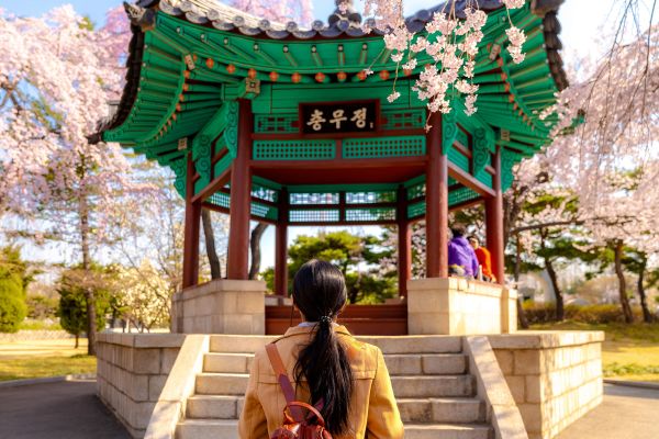 Woman standing in front of a temple in South Korea