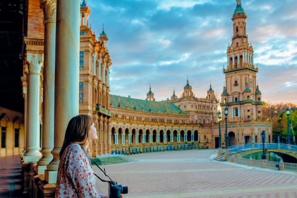 Female photographer looking out at Plaza de España in Spain