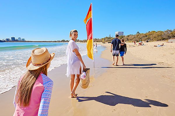 People walking along a beach