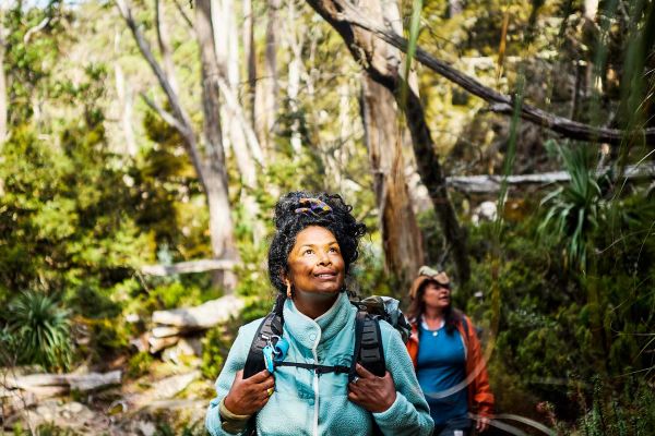 Two ladies hiking through the bush