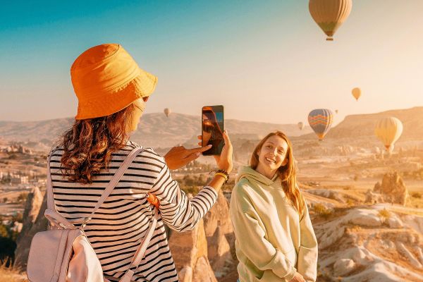 Posing in front of hot air balloons in Turkey
