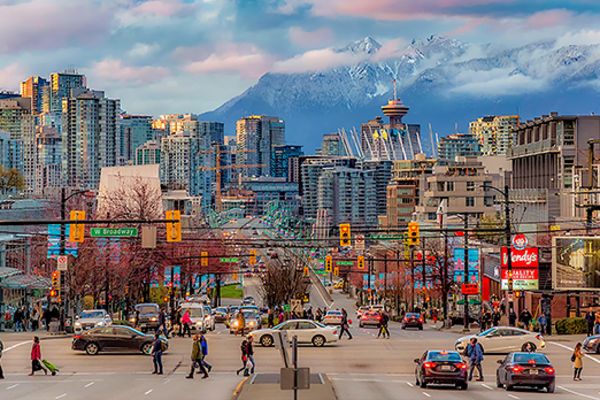 City of Vancouver with rolling, snow-covered mountains in the background