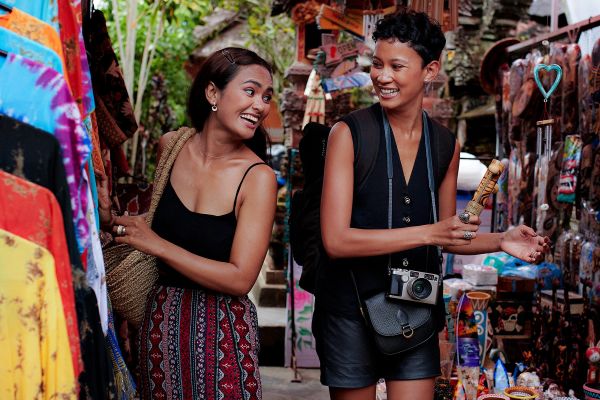 Couple shopping in a market street in Bali
