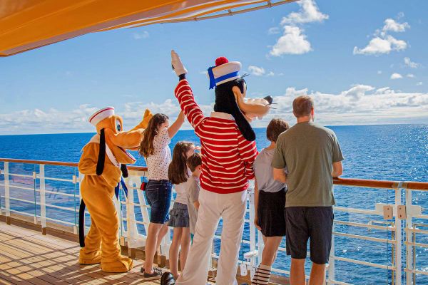 Family with goofie looking over railing
