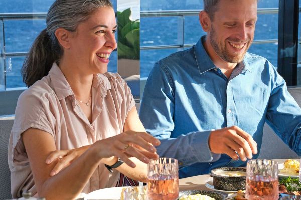 Two people enjoying fine dining onboard