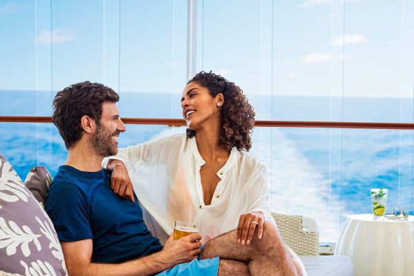 Couple lounging on top deck