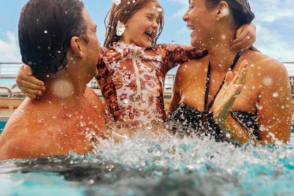 Family of 3 in the pool