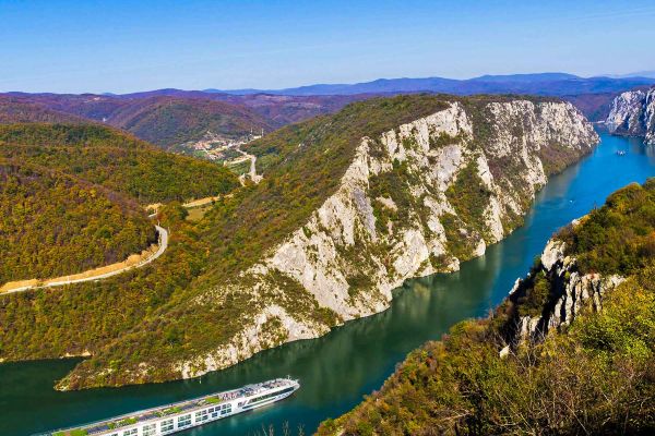 Ship travelling in between two cliffs