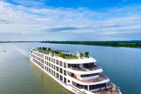 Cruise ship with green plainlands in background