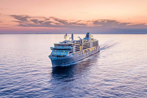Silversea cruise ship sailing under an early evening sunset