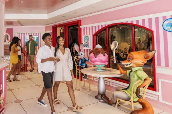 Smiling customers in a Zootopia-themed ice creamery