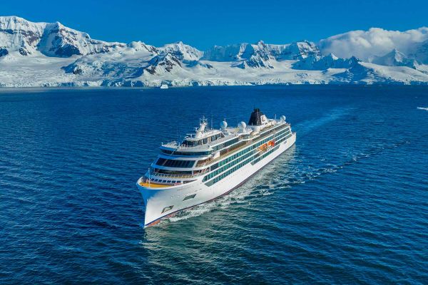 Viking cruise ship sailing away from glaciers