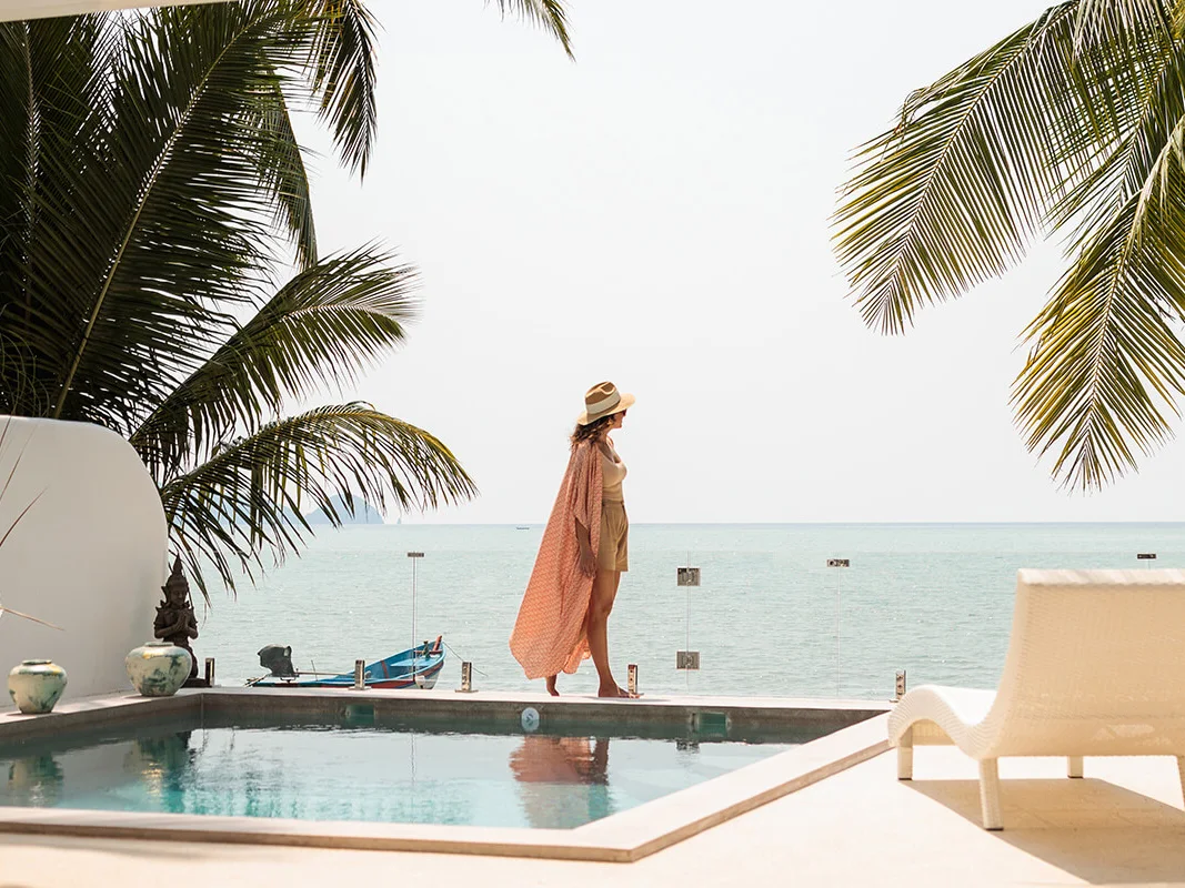 Women walking by pool tropical destination