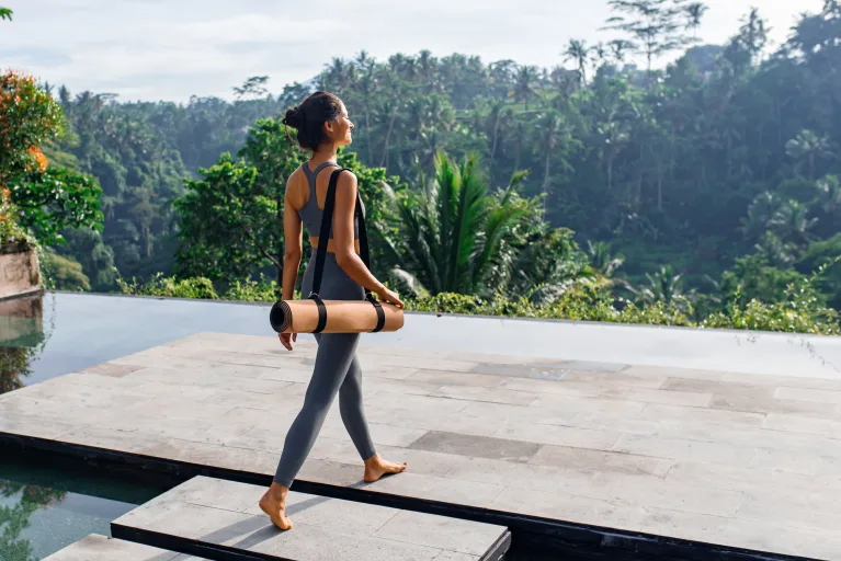 Women with a yoga mat