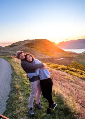 Young couple on road trip near Akaroa, Christchurch, South Island, New Zealand