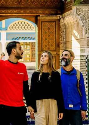 A guide and travellers on Intrepid's Classic Morocco tour
