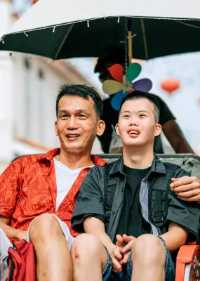 Two travellers in a trishaw in Malaysia