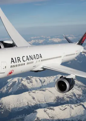 air canada plane flying over the rockies