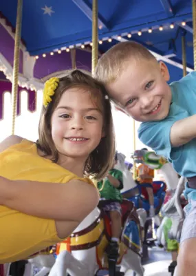 Kids playing on a carousel