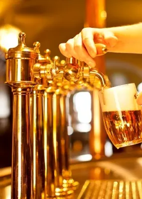 Full glass of beer served directly from the tap