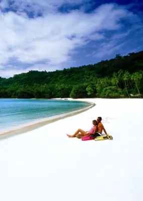Couple enjoying view of the ocean from the shore