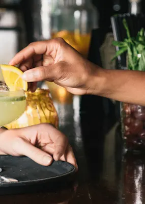 NYC cocktail being served at a bar