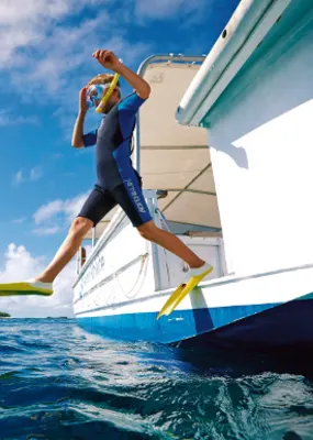 Man in a wetsuit jumped off a boat to go snorkeling