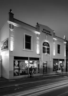 Black and white photo of a theater&#039;s façade