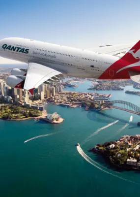 Qantas plane flying over the Sydney Harbour 