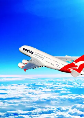 Qantas plane flying up in the clouds