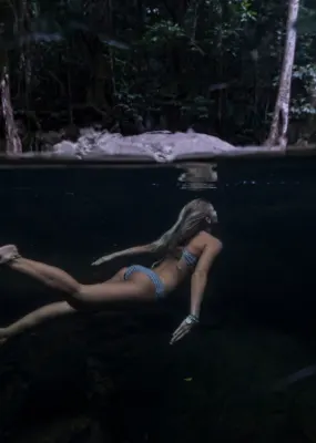 Woman in a bikini underwater 