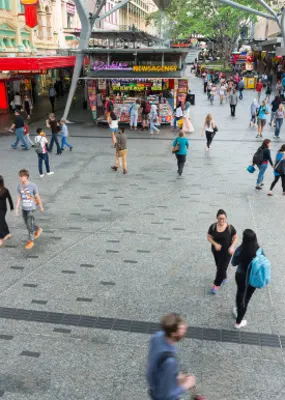 A crowd walking through the Queen Street Mall in Brisbane