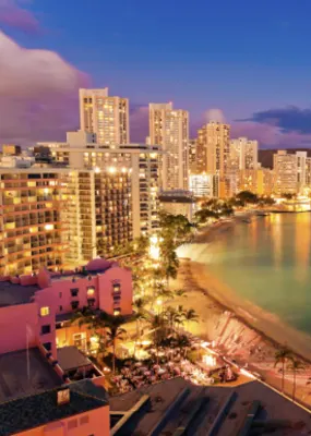 Magical aerial view of Buildings and Waikiki Beach in Hawaii during sunset