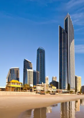 the towering buildings on the shore of a beach in the Gold Coast